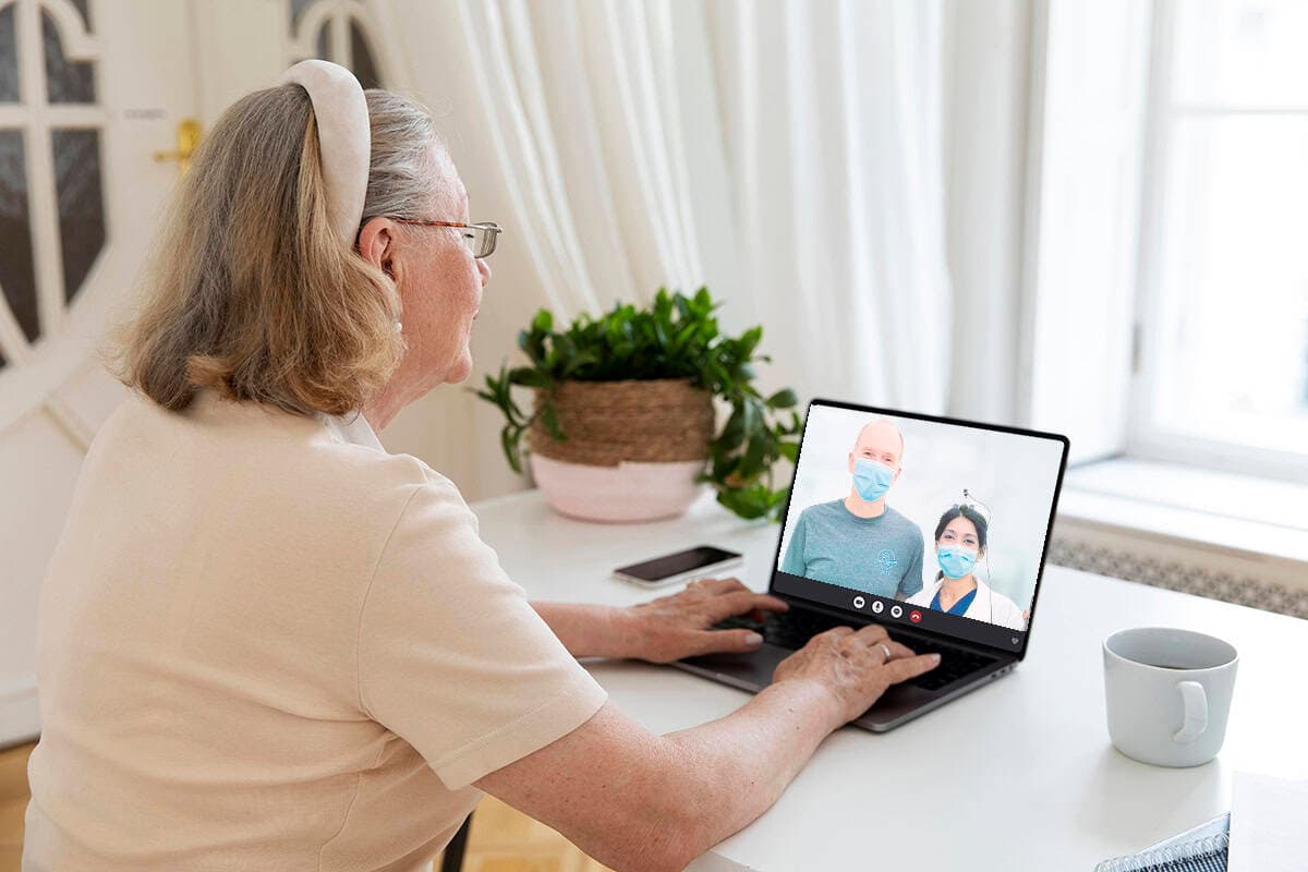 Patient making a video call to Dr. Sharda Harvey and her team